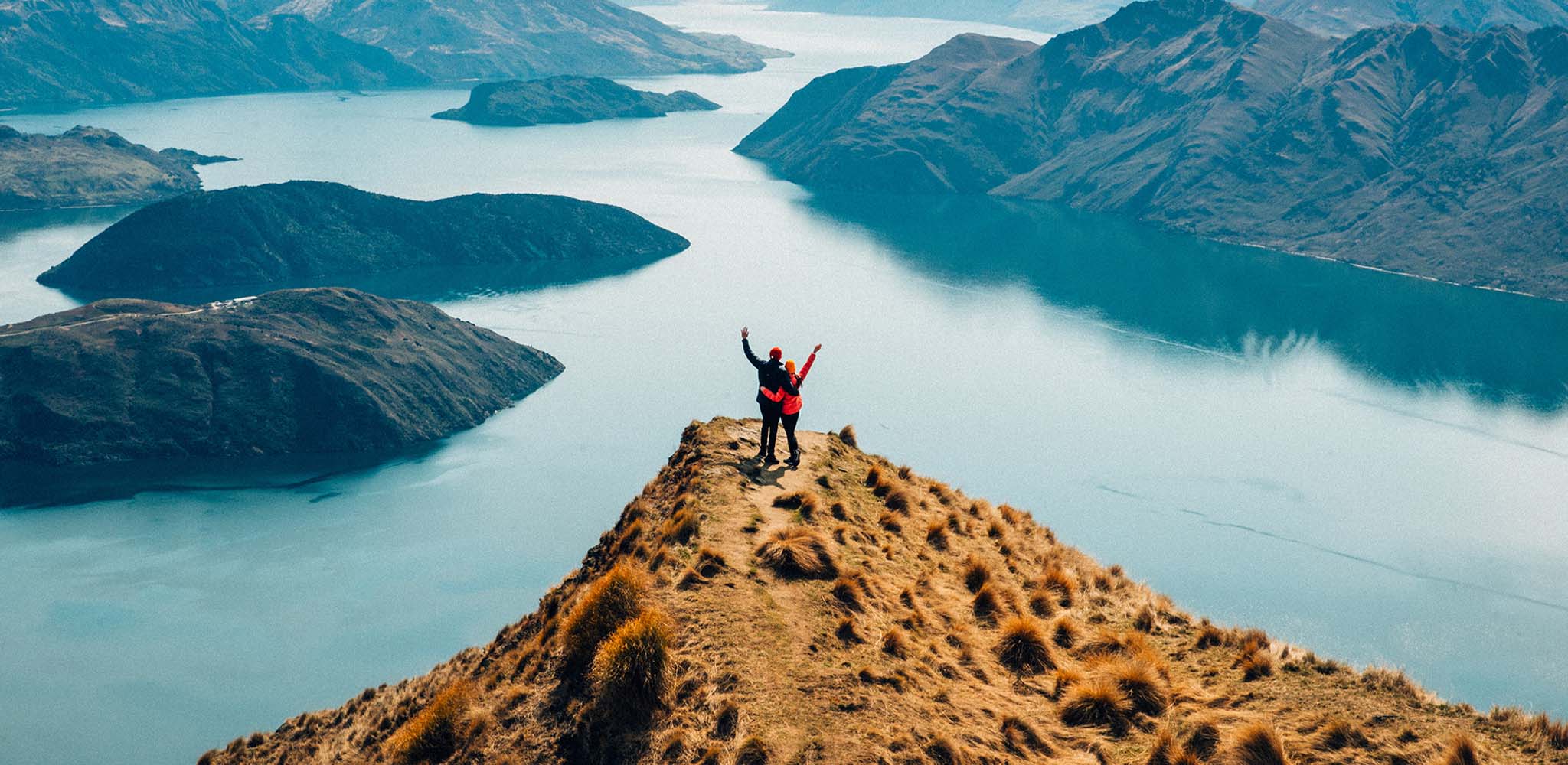Couple on a hiking adventure in Wanaka, New Zealand with Accor Plus member benefits