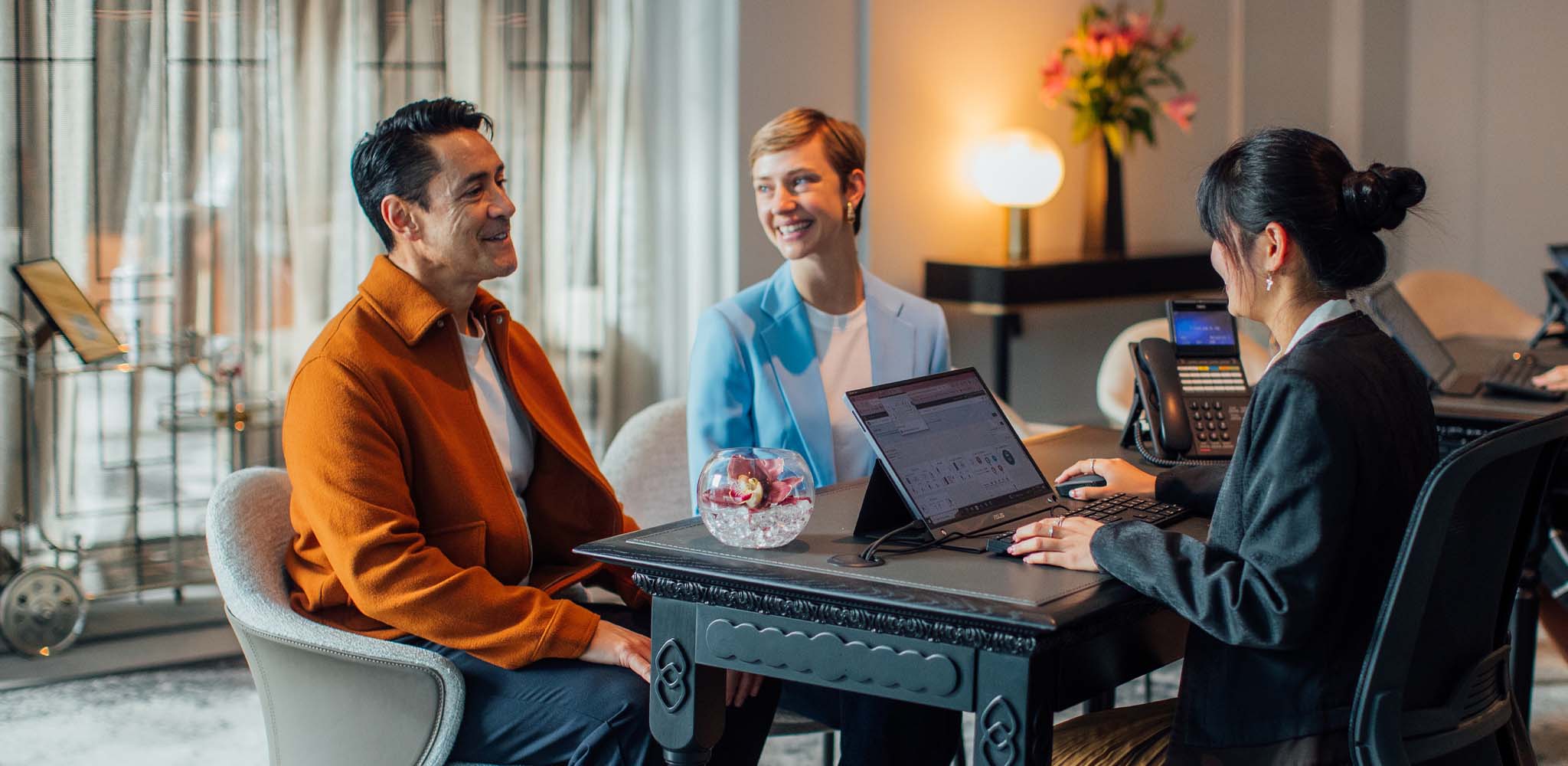 Couple checking into a luxury Accor hotel in New Zealand using Accor Plus membership