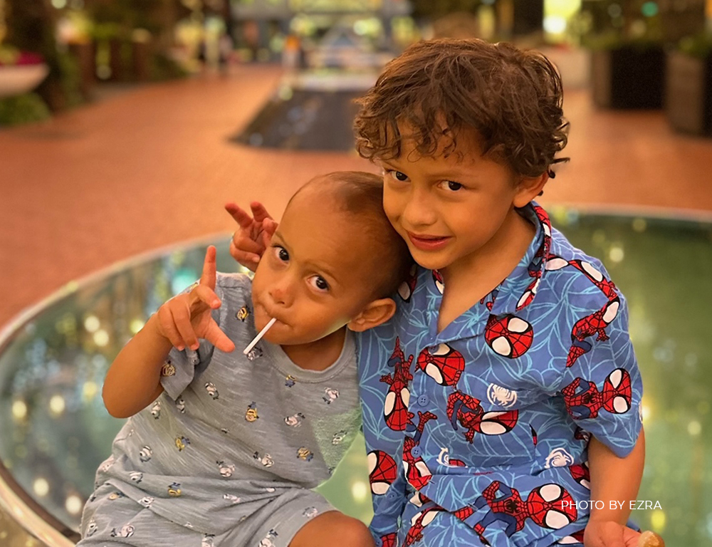 Accor Plus members with their children enjoying a sunny day at the Sofitel Auckland Viaduct Harbour pool area.